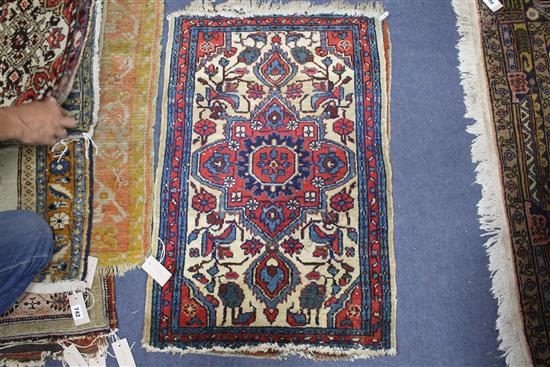 A pair of Persian blue ground small mats, decorated with animals amongst trees and flowers, and three other mats with stylised floral